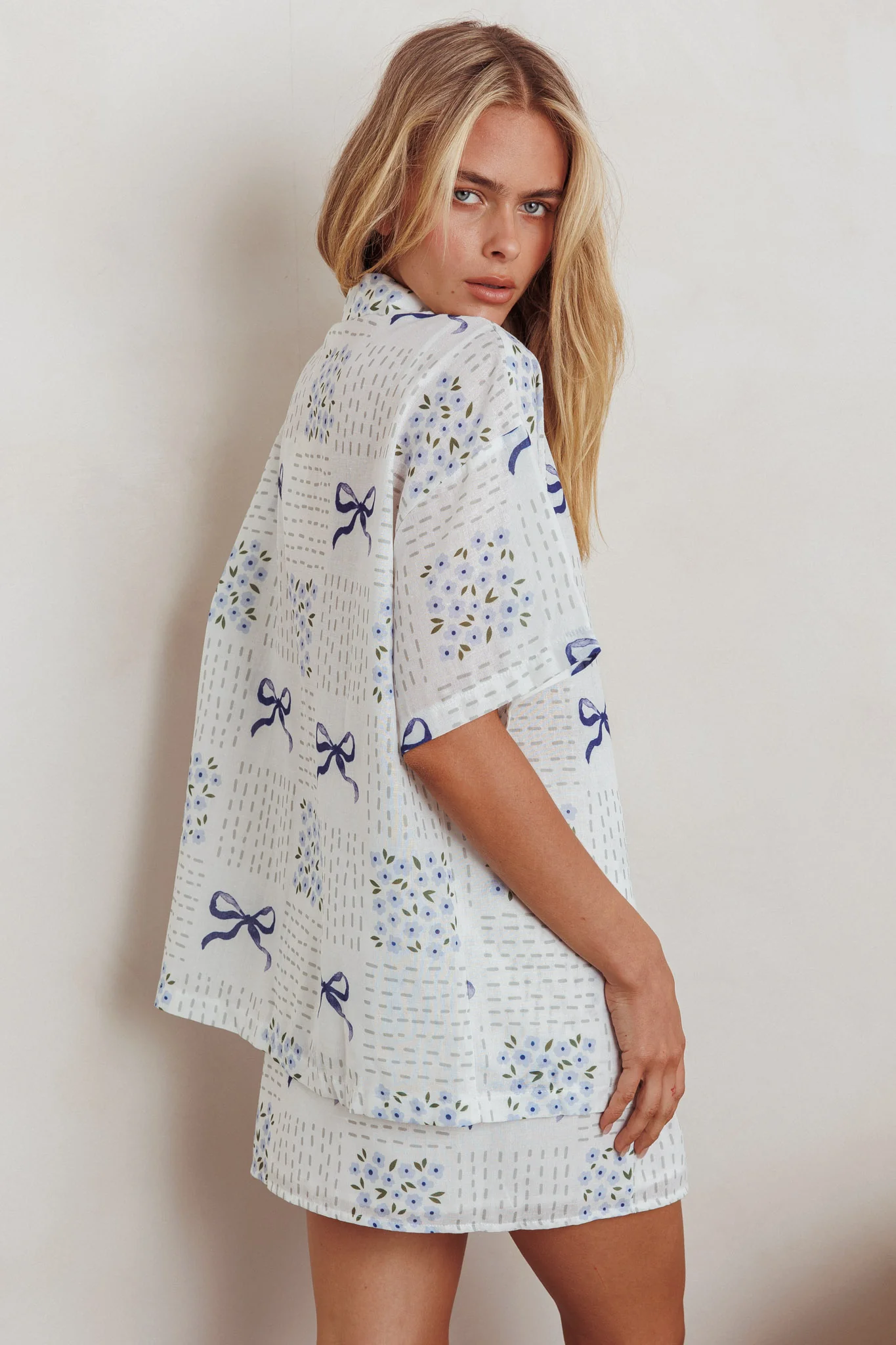 Ithaca Wrap Mini Skirt Bow Print Blue - Image 4